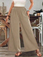 Beige wide-leg pants with embroidered side stripes