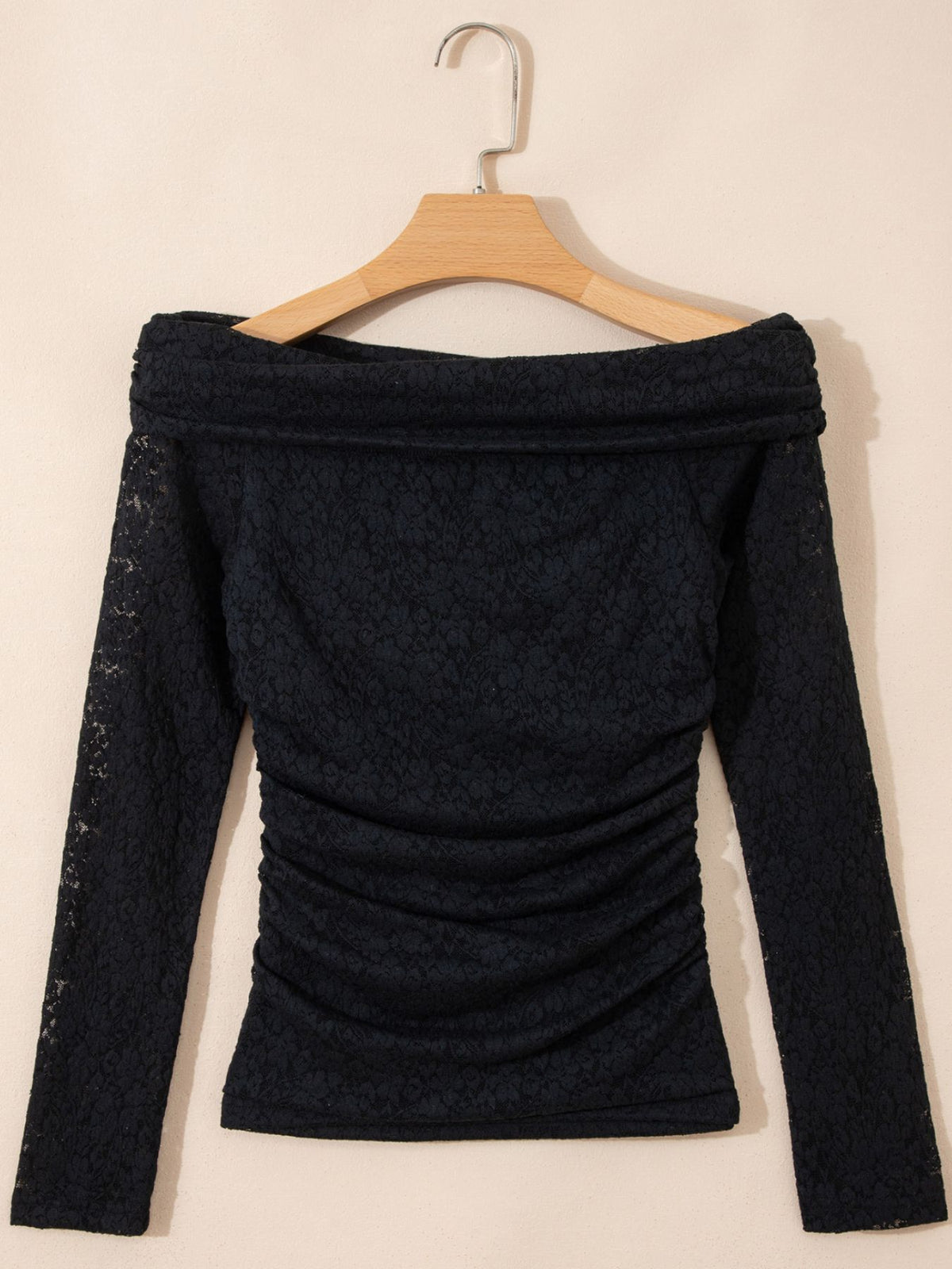 Back product view of black top with gathered detailing