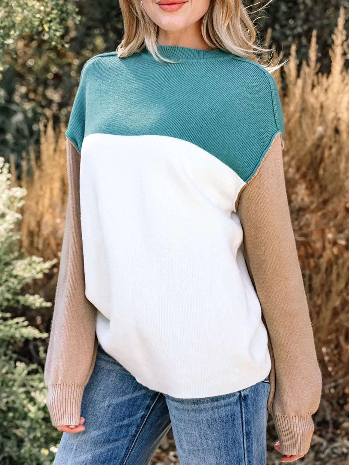 Side view showing taupe sleeves and color-block body