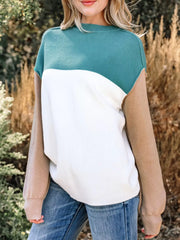 Side view showing taupe sleeves and color-block body