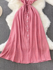 Pink polka-dot dress laid flat, front view