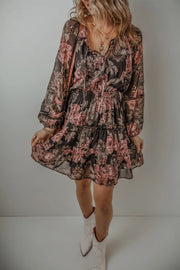 Full front view of long-sleeve floral tie-neck mini dress