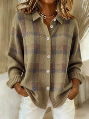 Taupe and brown plaid button-up cardigan with ribbed cuffs, worn with white trousers.