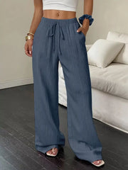 Back view of slate-blue wide-leg pants with gathered drawstring waist