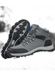 Grey lace-up boot displayed beside the matching boot with its patterned outsole facing outward
