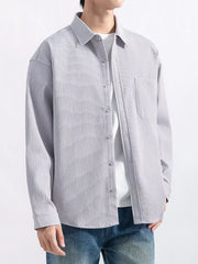 Light-colored button-down shirt displayed from the front
