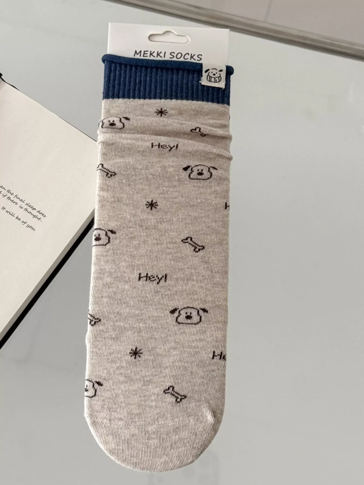 Beige patterned sock shown flat