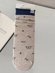 Beige patterned sock shown flat