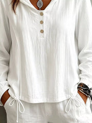 Women's white hooded long-sleeve blouse with button details and drawstring, back view