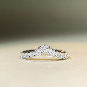 Low side view of the raised stones along the V-shaped ring.