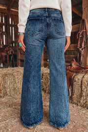 Medium-blue acid-wash flare jeans shown from the back