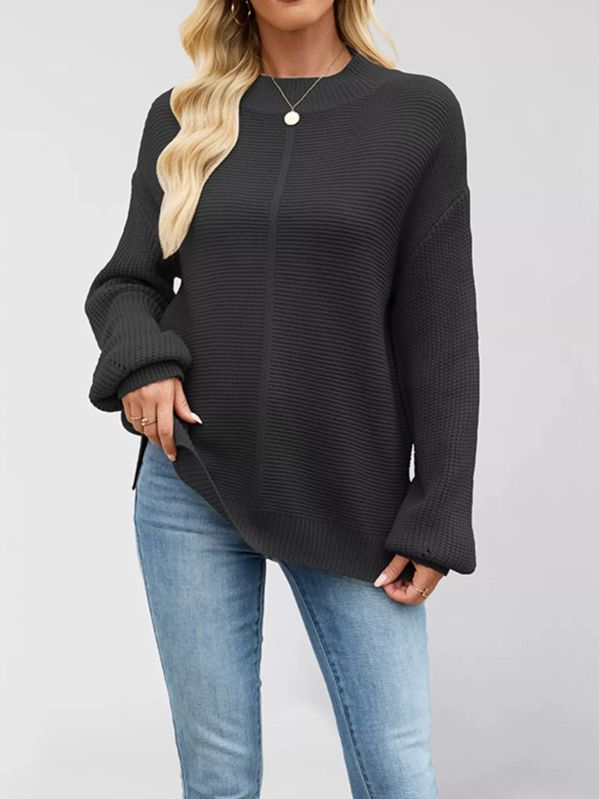 Women’s ribbed mock-neck drop-shoulder sweater in black front view