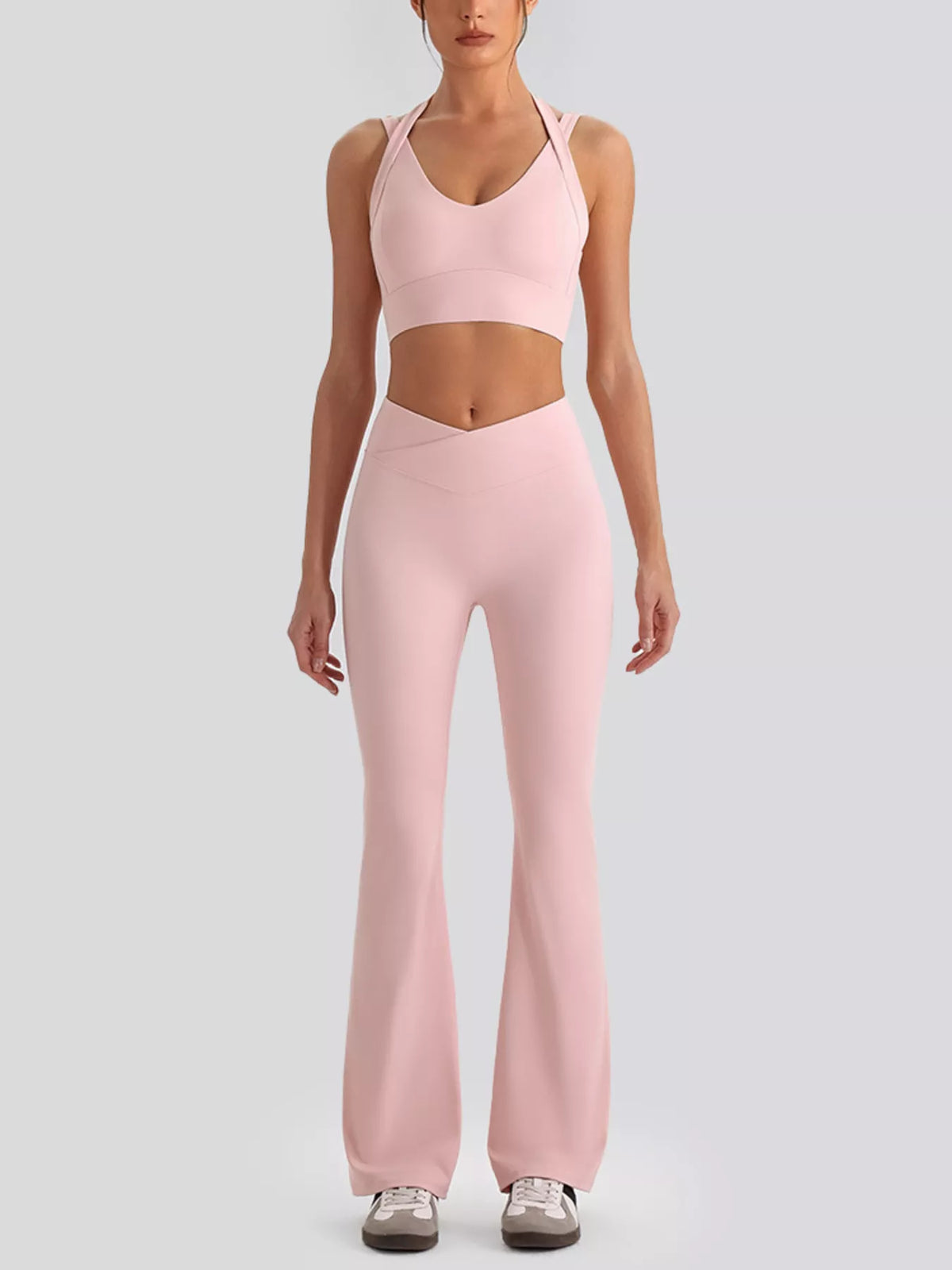 Front view showing fit of seamless criss-cross v-neck tank and leggings active set