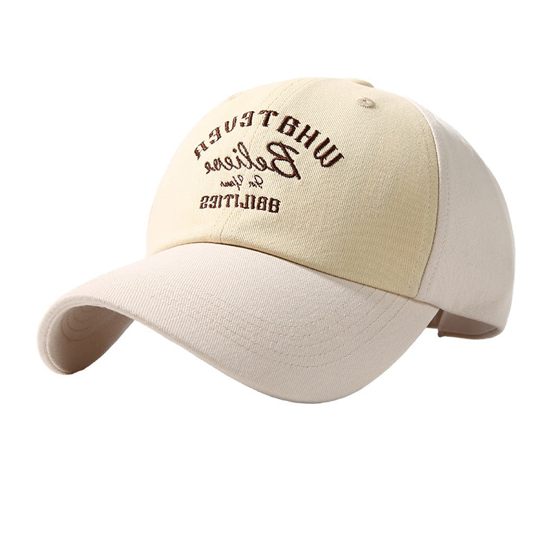Beige and white two-tone baseball cap with embroidered front lettering