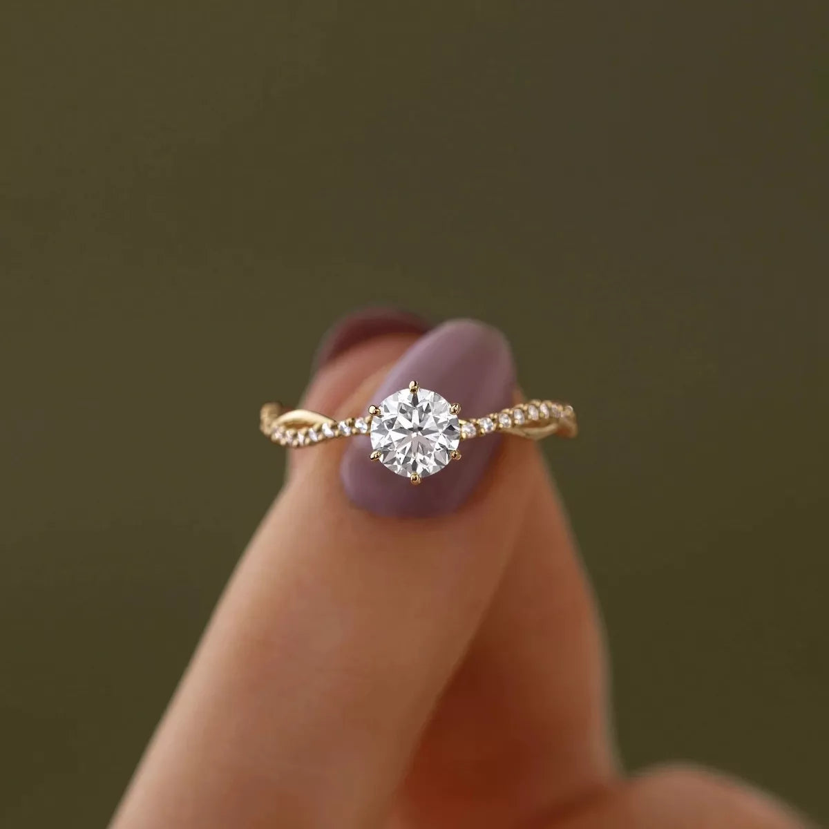 Round clear zircon solitaire ring viewed from the front on white