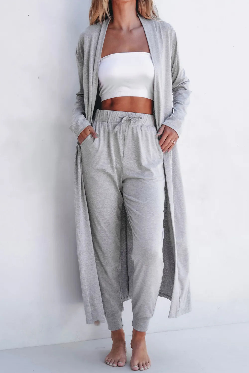 Front pose of model wearing gray open-front cardigan with matching lounge pants