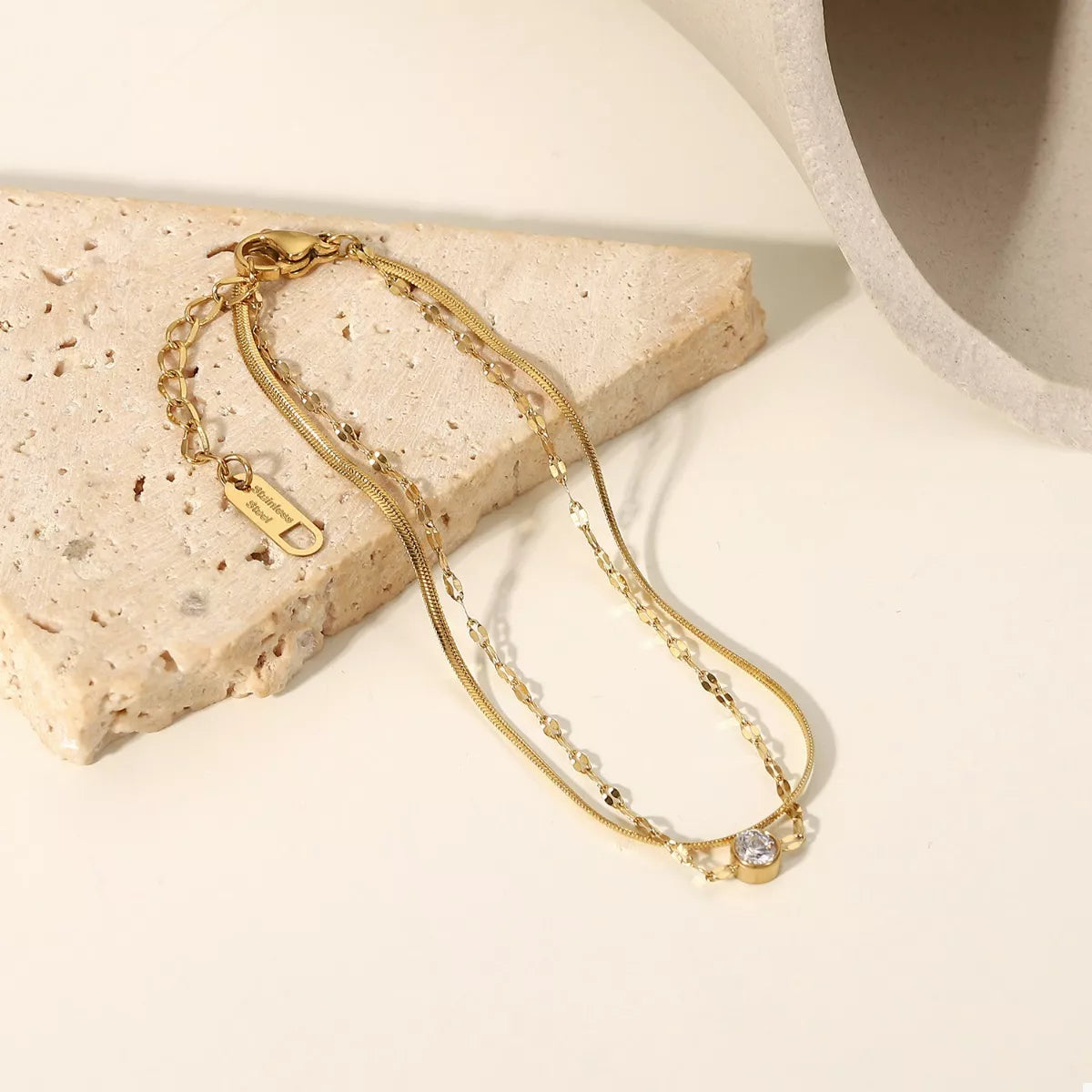 Close-up of zircon accents on layered bracelet