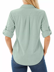 Back view of sage green button-down shirt with rolled sleeves