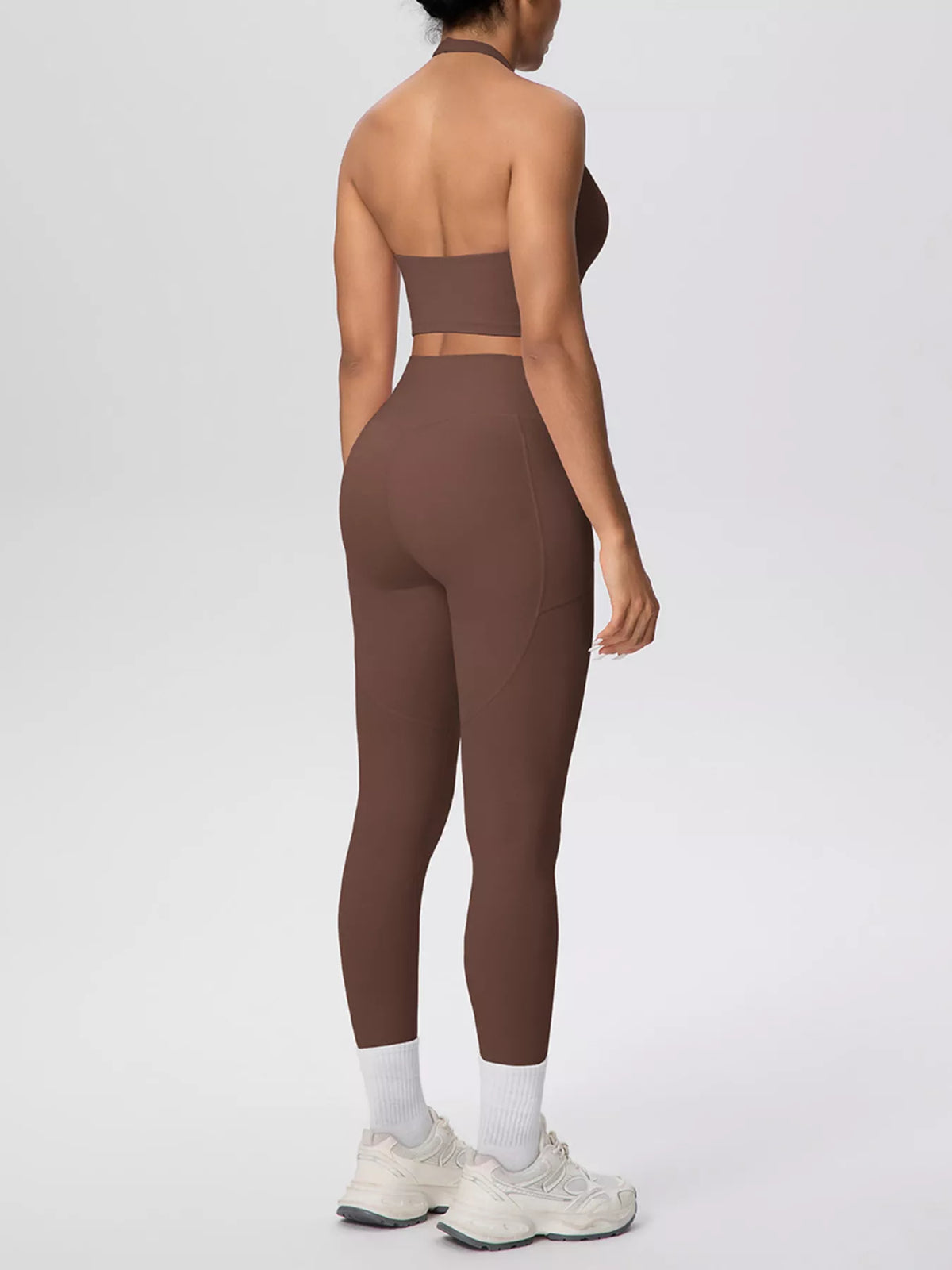 Back view of brown halter crop top and leggings