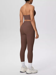 Back view of brown halter crop top and leggings
