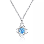 Four-leaf clover pendant on a silver-tone chain against white background
