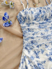 Close-up of blue floral mini dress bodice and straps