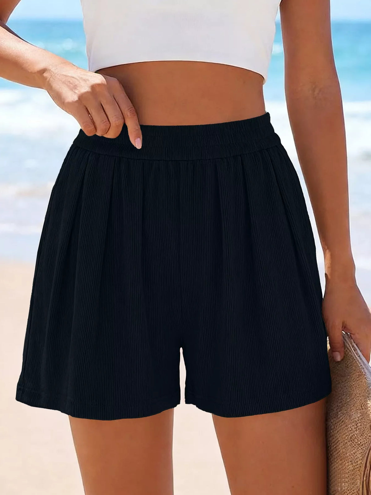 Front view of black shorts with smooth waistband and relaxed legs