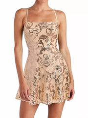 Beige mini dress with gold-toned floral sequins and a straight neckline, front view on a model.