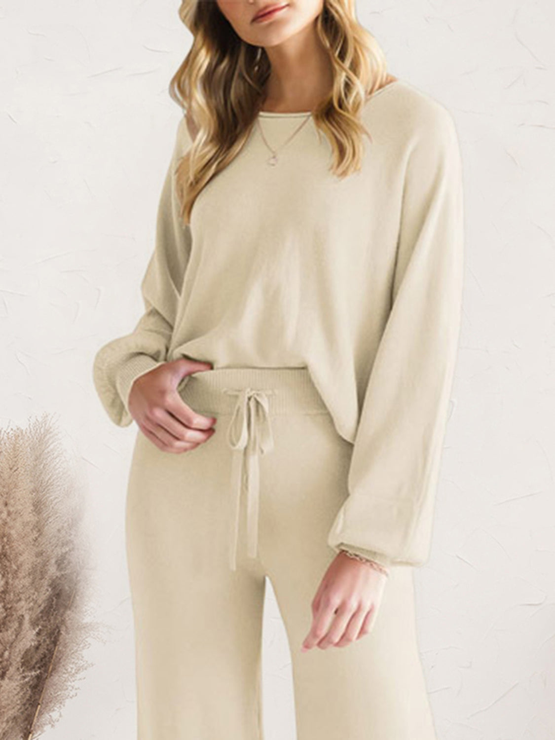 Close view of cream long-sleeve lounge top and drawstring pants