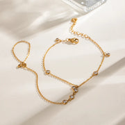 Gold hand chain arranged to show wrist and finger loops