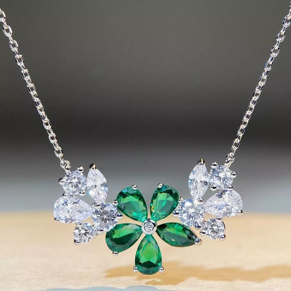 Silver-tone flower necklace with dark green center stones