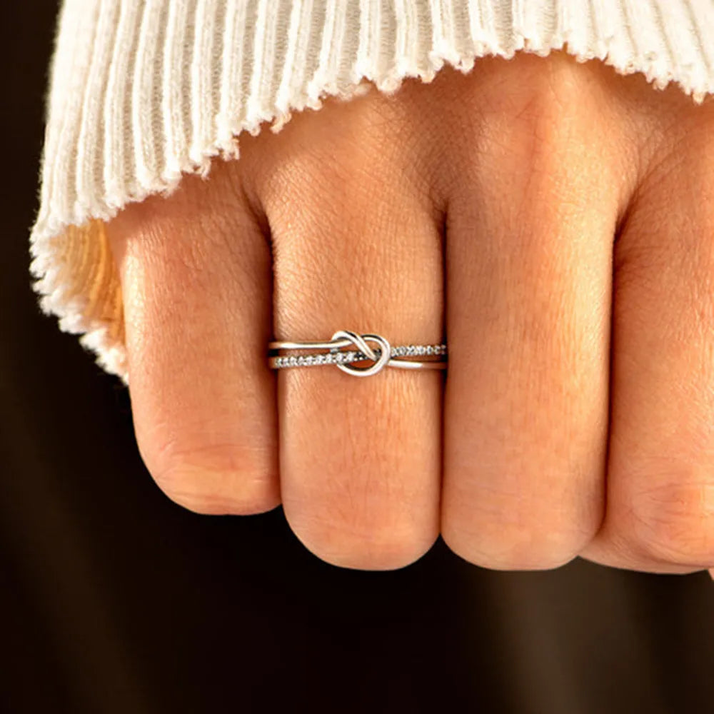 Double-layer sterling silver knot ring worn on a hand