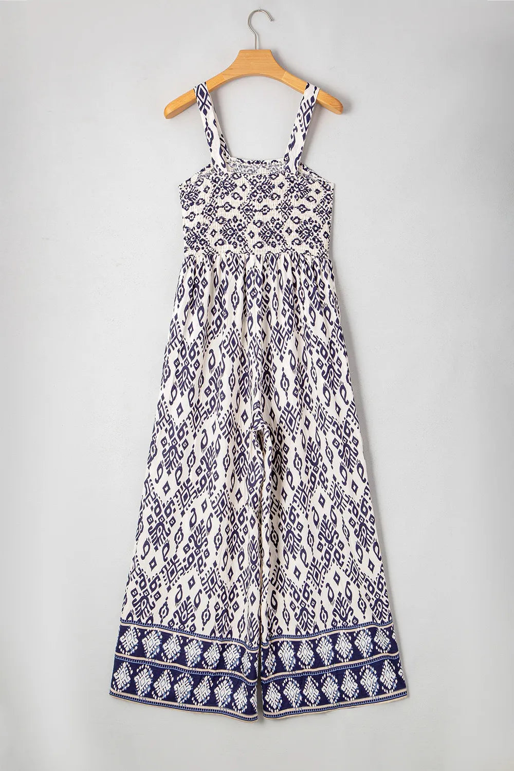 Printed wide-leg jumpsuit on hanger, front view