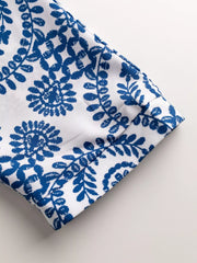 Women's printed tie-waist button-front romper, close-up of printed sleeve