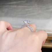 Side profile of the raised round center stone and embellished silver-tone band.