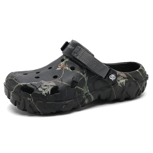 Black branch-print round-toe clog with ventilation holes and an instep strap, side view