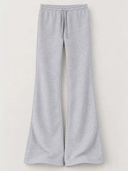 Grey drawstring flare pants displayed flat on a white background