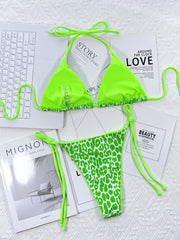 Close-up of leopard-print bikini with neon-green ties
