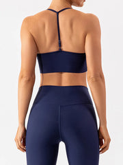 Back view of navy active bra with adjustable center strap