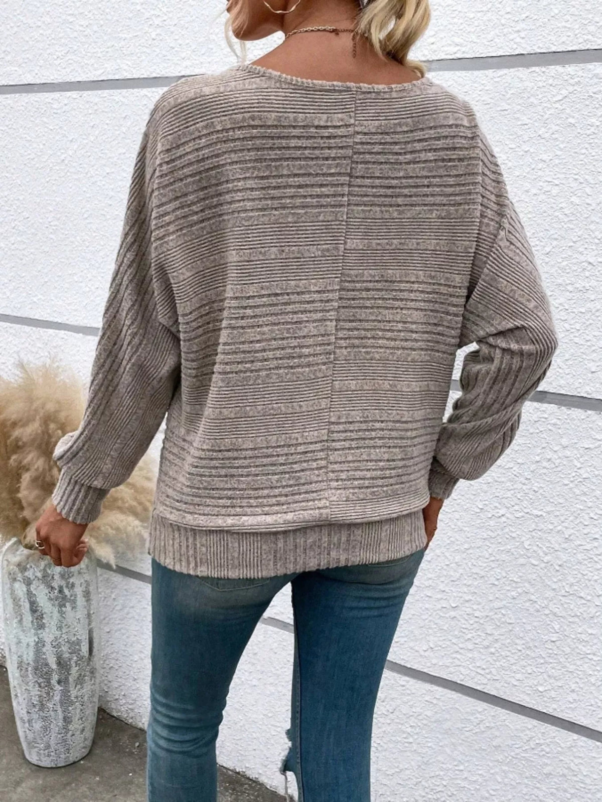 Women’s ribbed round-neck long-sleeve top in taupe back view