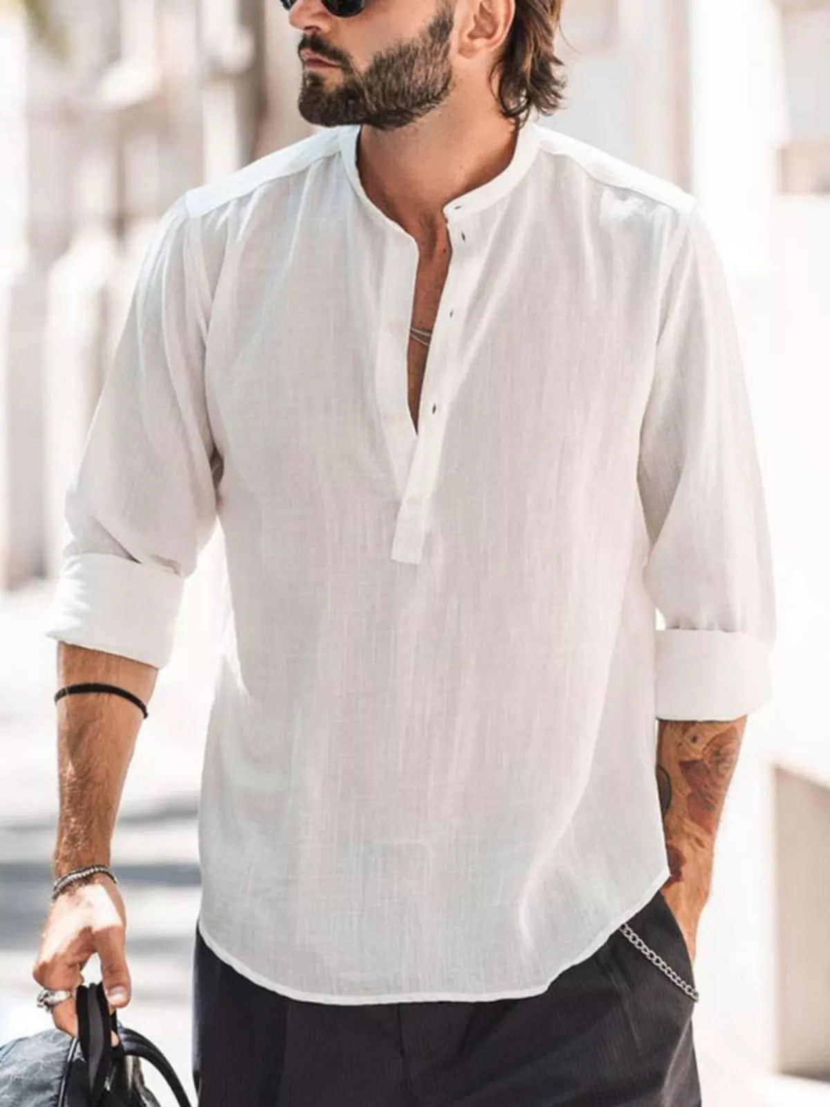 Model wearing a white long-sleeve shirt with an open short placket