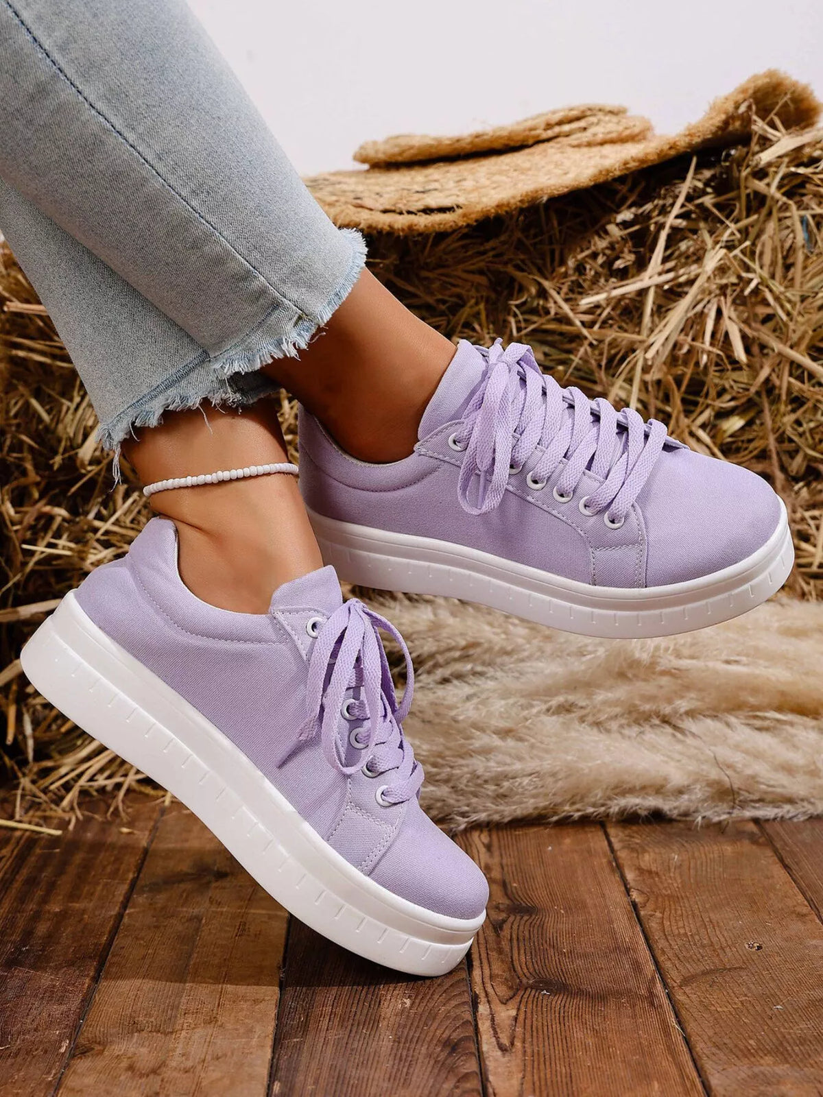 Lavender lace-up platform sneaker worn with jeans