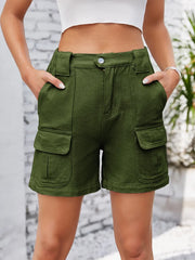 Front view of olive green cargo shorts with flap pockets.
