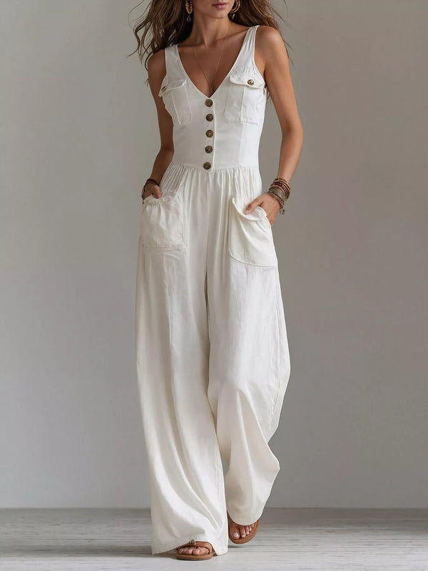 White button-front jumpsuit with large front pockets, angled view