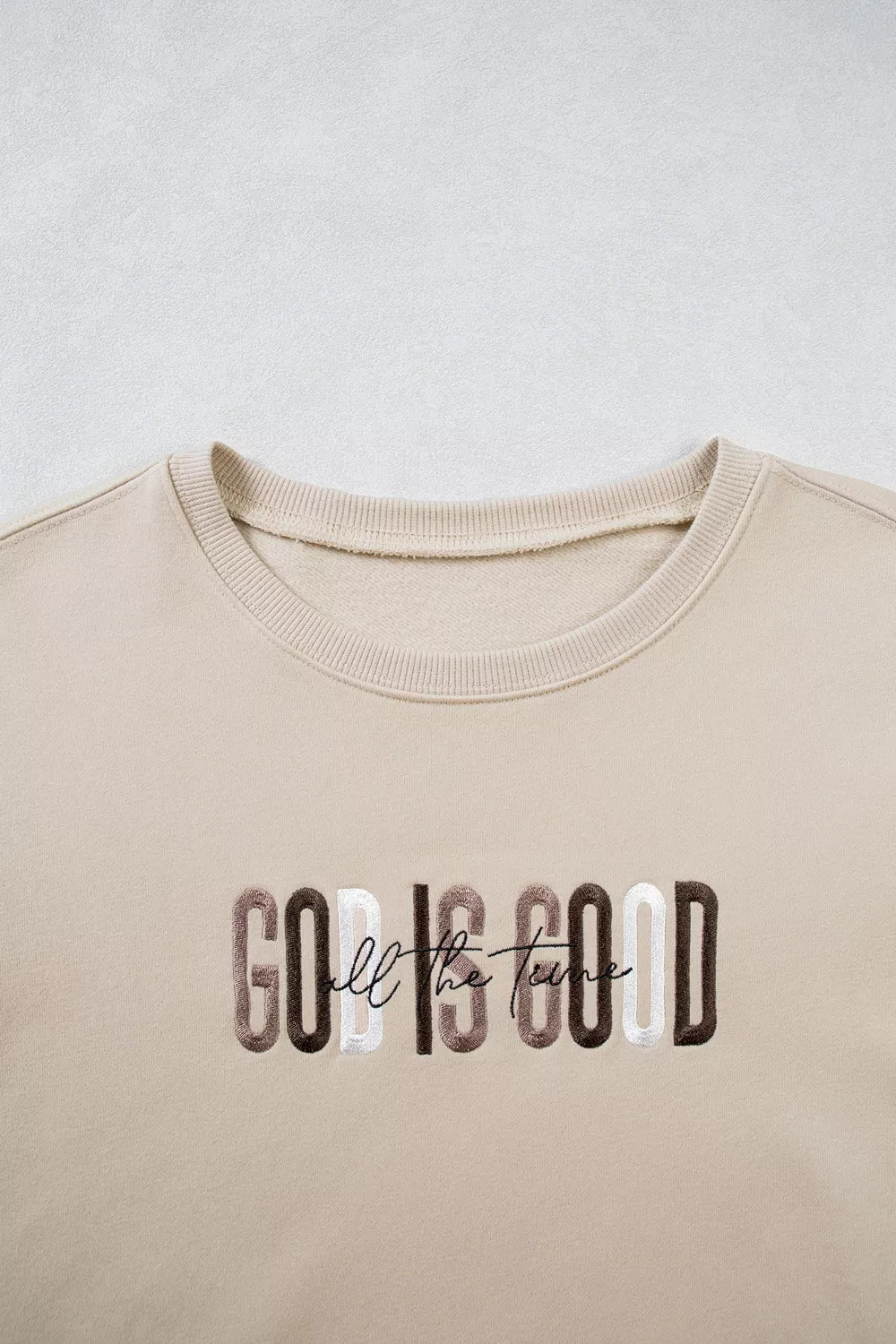 Close view of front chest graphic and crew neckline