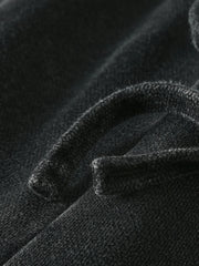 Close-up of the black fabric and hem stitching