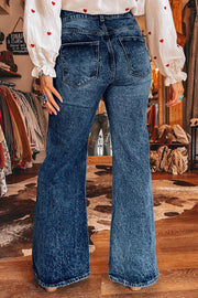 Back view of blue flare jeans showing back pockets
