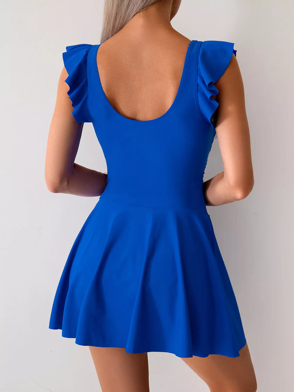 Blue ruffle-sleeve swim dress shown from the back