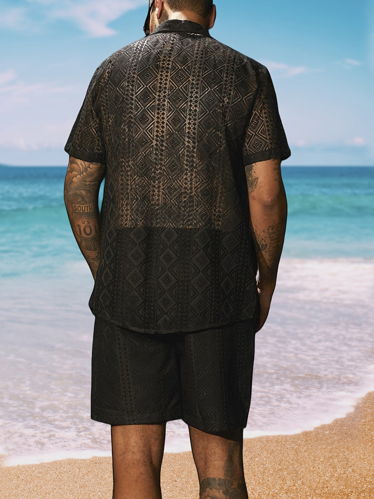 Back view of the dark geometric-print shirt