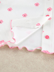 White ribbed floral-print shorts with pink scalloped hem detail